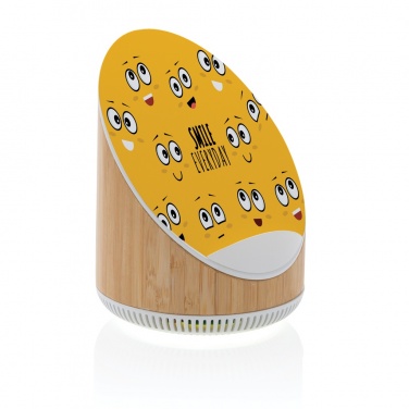 Logotrade meene foto: Ovate bambusest 5W kõlar koos 15W juhtmevaba laadijaga